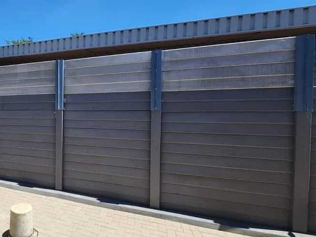 A precast concrete wall that has been professionally extended to a greater height.