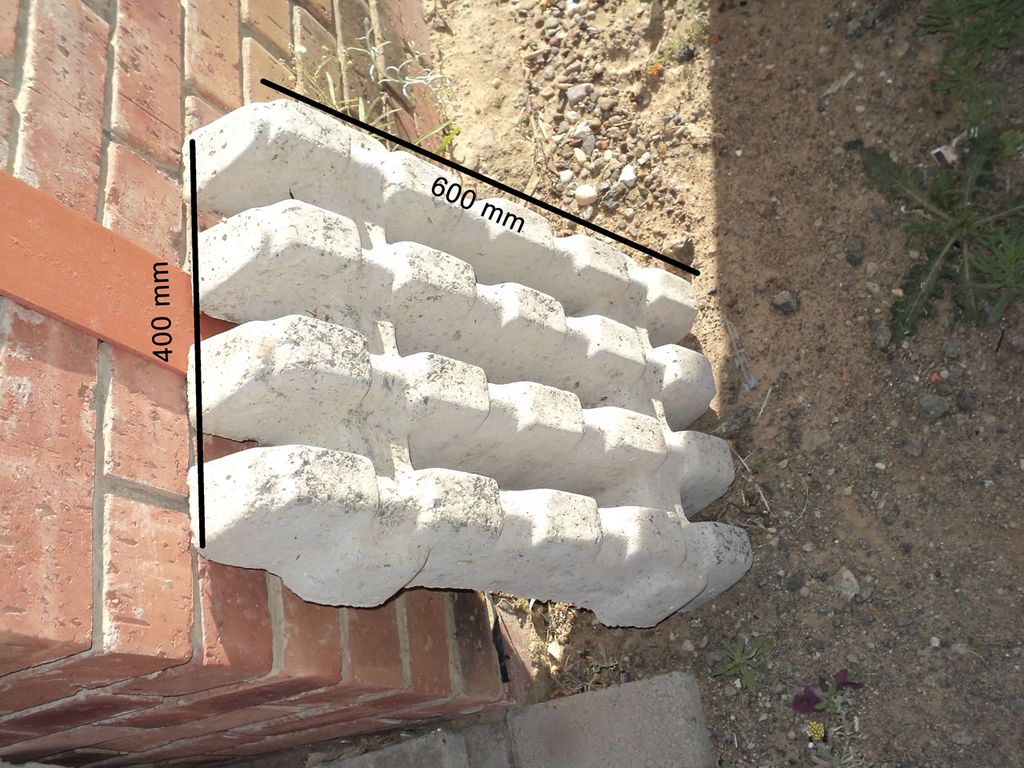 Heavy-duty concrete grass block paver for erosion control.