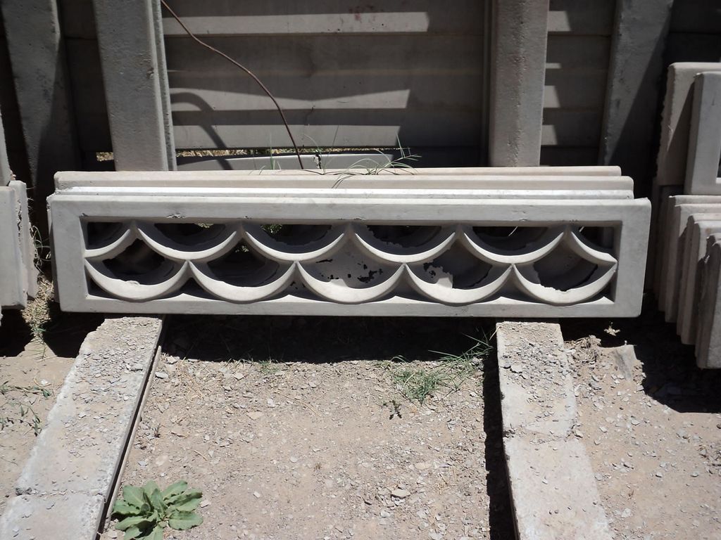 A decorative precast concrete wall panel with a shell pattern.
