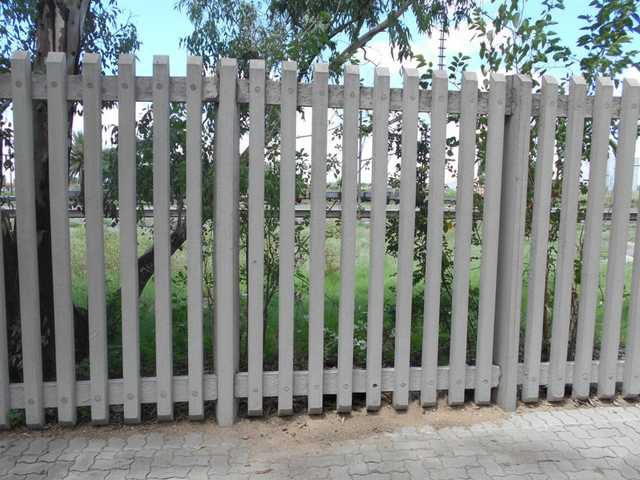 Heavy-duty concrete palisade fencing providing security.