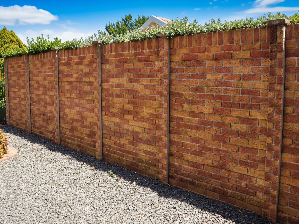 A close-up view of a Terracotta Glow (Van Wyk Finish) precast wall.